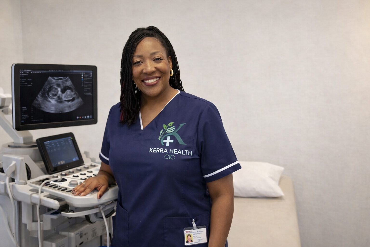 Connie Ndhlovu, Diagnostic Medical Sonographer and founder of Kerra Health, in the clinic beside an ultrasound machine.